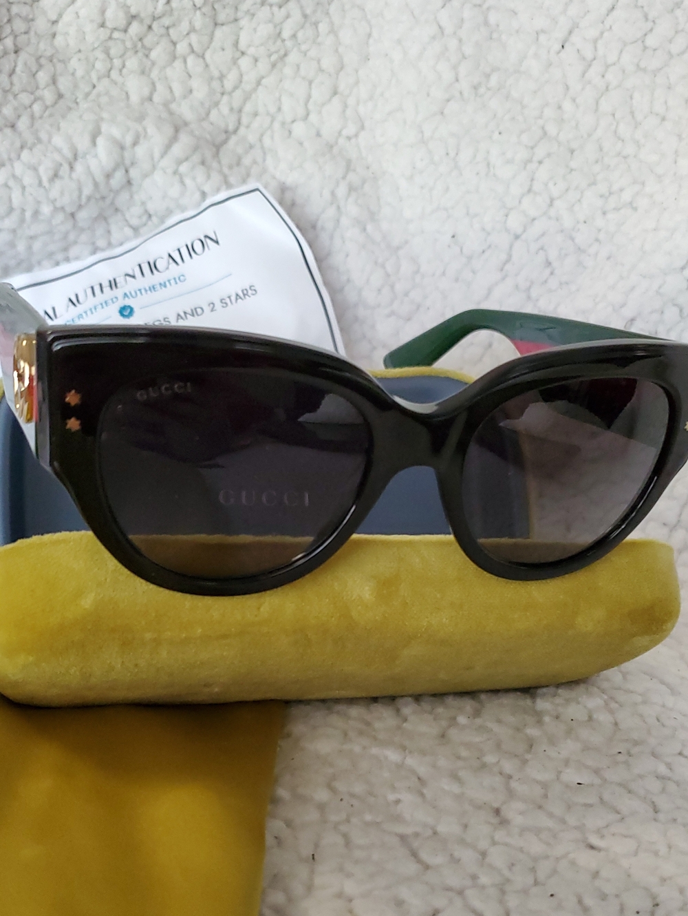 Gucci Black Cat-Eye Sunglasses with Subtle Gold Accents